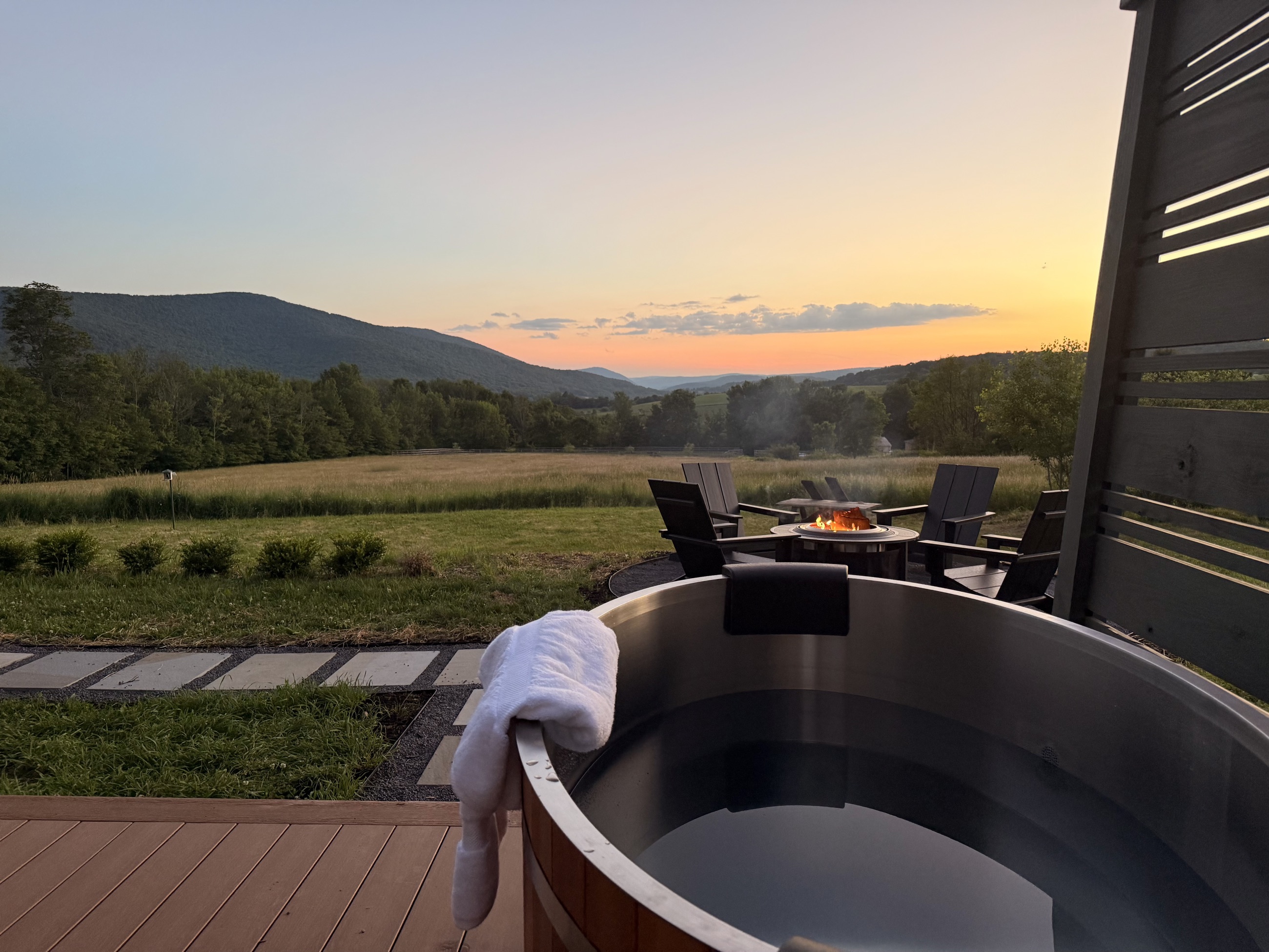 The cold plunge on the back deck, facing the ridge at dusk